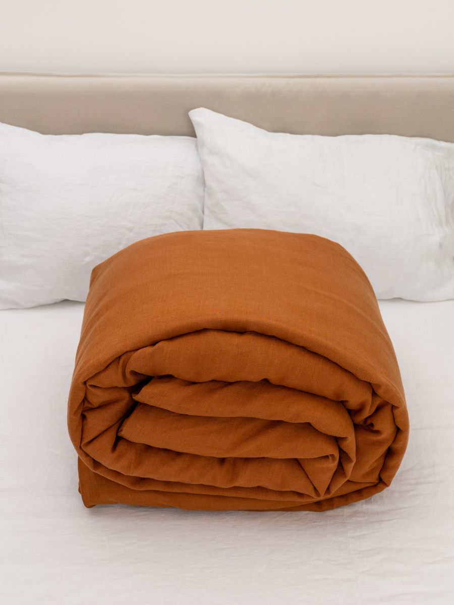 100% flax linen Cinnamon Brown duvet cover rolled neatly – OEKO-TEX Standard 100, easy storage