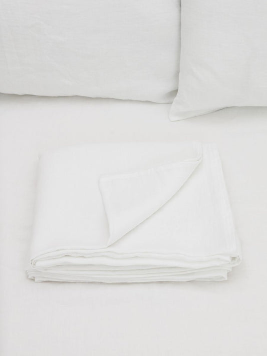 100% flax linen Magnolia White flat sheet folded with corner turned – crisp, luxurious feel